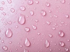 pink water droplets on a smooth surface photo