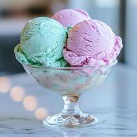 Vibrant ice cream scoops in a glass bowl photo