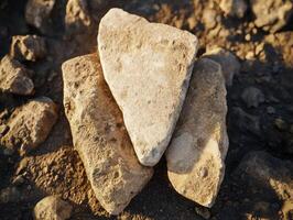 Closeup of weathered stones on the ground photo