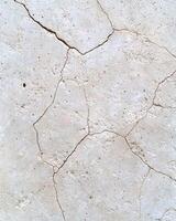 Cracked concrete surface texture photo