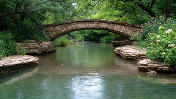 Serene stone bridge over tranquil forest stream photo