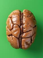 Close up of a walnut on a vibrant green background photo