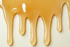 Dripping honey texture background photo