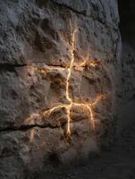 Glowing cracks in rocky surface photo