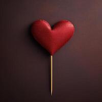 Glittering red heart on dark background photo