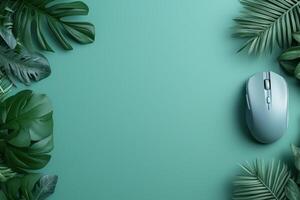 tropical leaves frame with computer mouse photo