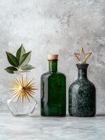 Decorative glass bottles and botanical elements photo