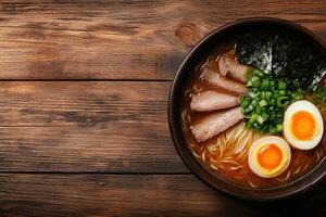 Delicious ramen noodle soup with pork, egg, and green onions photo