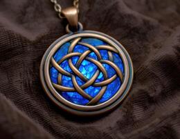 Intricate celtic knot pendant on dark fabric photo