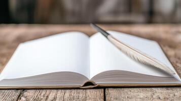 open book with feather on wooden table photo
