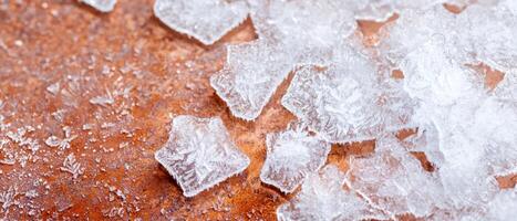Frozen crystals on a rusty surface photo