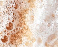 Bubbly beer foam texture background photo