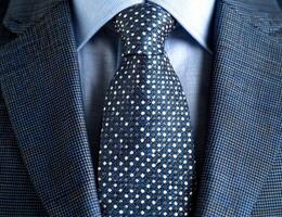 Close up of a patterned necktie on a suit photo