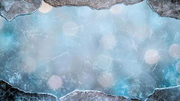 Frozen lake surface with cracked ice photo