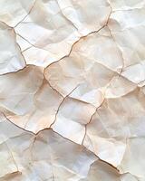 Crumpled paper texture with cracks and folds photo