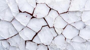 Shattered glass surface with cracks and red stains photo