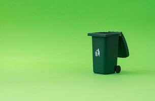 Trash recycle bin against green background. Container for disposal garbage waste and save environment. Minimal earth day concept. Green eco idea. photo