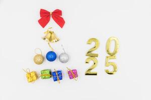 Gold 2025 numerals on a white background. 2025 New Years Eve Celebration, Holiday background Happy New Year 2025. Numbers of year 2025, celebrating New Year holiday, Space for text photo