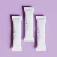 Three white packets of pills on a purple background photo