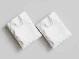 Two white t - shirts on a gray background photo