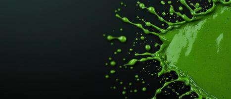 Vibrant green paint splash creating a dynamic and energetic visual effect. photo