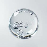 A close up of a glass ball with bubbles inside photo