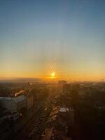 Scenic cityscape with glowing sunrise over urban horizon in Budapest, Hungary. photo