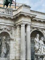 Historic European architecture with classical statues and columns in Vienna, Austria photo
