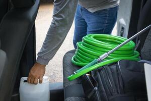 Cleaner manwith your tools. Conceptual image of car washing job. photo