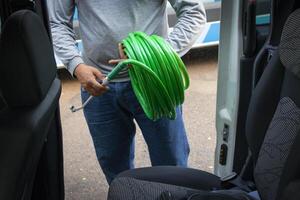 Cleaner manwith your tools. Conceptual image of car washing job. photo
