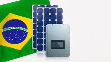 Solar photovoltaic panels, inversor and Brazil Flag isolated on white background. photo