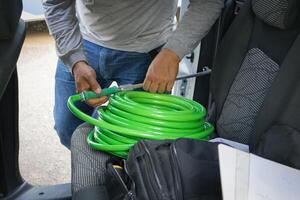 Cleaner manwith your tools. Conceptual image of car washing job. photo