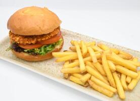 Gourmet American-Style Breaded Chicken Burger and Fries photo