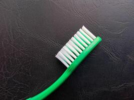 Tooth Brush with soft hair isolated on black background photo