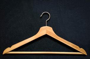 Closeup view of Cloth hanger on fabric background photo