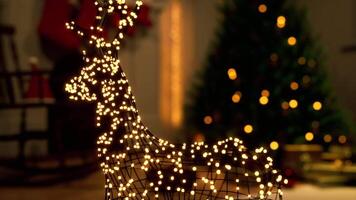 Christmas preparation with decorative lights on a reindeer in a cozy setting video