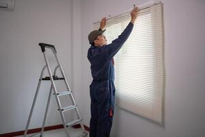 Professional Worker Installing Window Blinds in a Modern Home photo