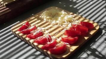 Slices of cheddar and colby cheese disappearing from a stack on a cutting board, stop motion animation video