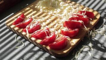 Slices of cheddar and colby cheese disappearing from a stack on a cutting board, stop motion animation video