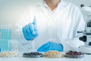 Scientist analyze biochemical samples in advanced scientific laboratory. Research and development staff use dropper mix microbiological developmental of perfume. Biotechnology research in science lab photo