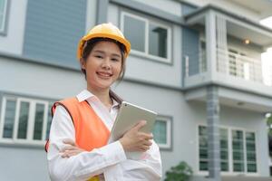 inspector or engineer is inspecting construction and quality assurance new house. Engineers or architects or contactor work to build the house before handing it over to the homeowner photo