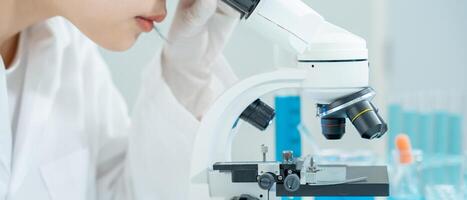 Scientist analyze biochemical samples in advanced scientific laboratory. Medical professional use microscope look microbiological developmental of viral. Biotechnology research in science lab. photo