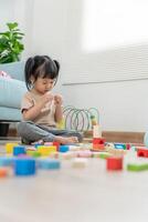 Happy Asia children play and learn toy blocks.family is happy and excited in the house. daughter having fun spending time, Activity, development, IQ, EQ, meditation, brain, muscles, essential skills. photo