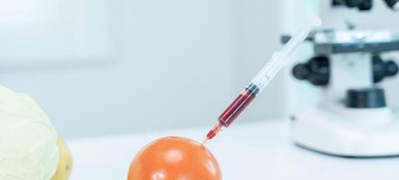 Scientist check chemical food residues in laboratory. Control experts inspect quality of fruit, scientists inject chemicals into apples for experiments, hazards, prohibited substance, contaminate photo