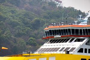 Large Ship at Rest Amidst the Endless Blue. Ferry boat full of window in close up photo