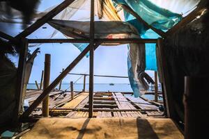 View from Within a Fisher Bamboo Bagan on the Ocean. Fisherman Floating Structure on the Sea. photo