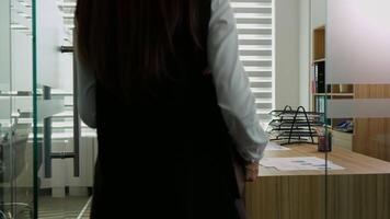 Two coworkers geting ready to work on laptop in office. video