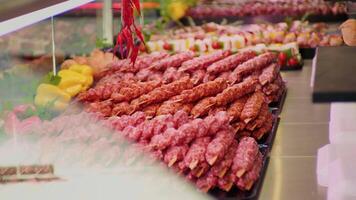Freshly prepared turkish kebab on skewers layout in a shop. video