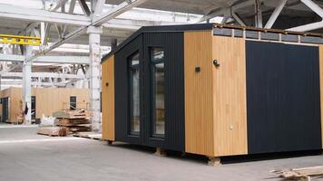Prefabricated modular mobile wooden house at construction site video
