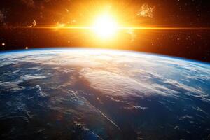 Earth sunrise with bright sun and clouds. photo